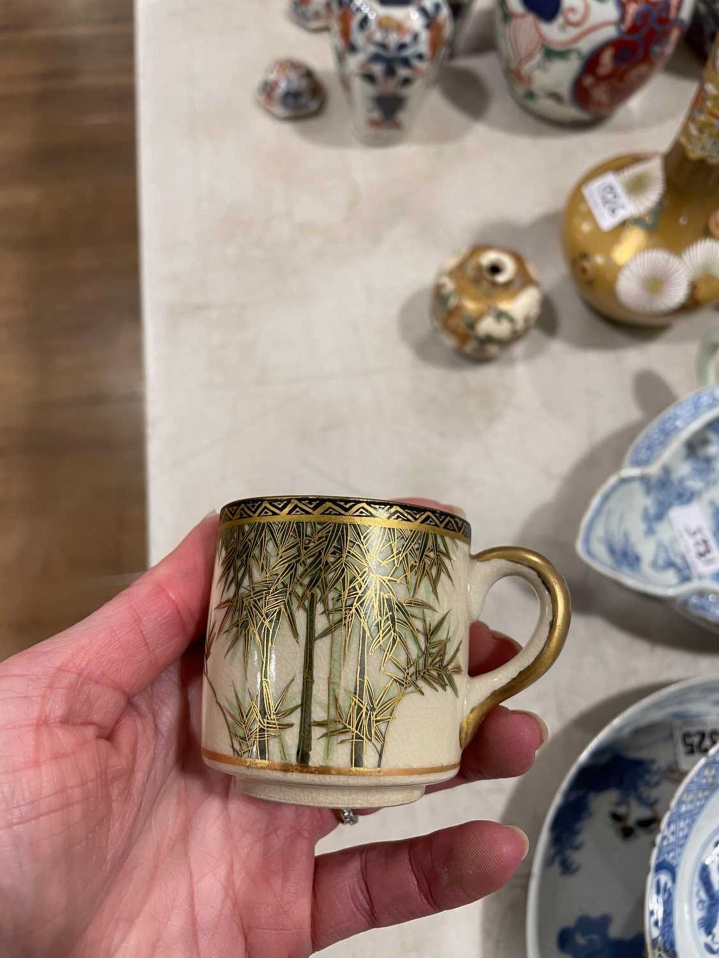 A Japanese satsuma bowl of flowerhead form, centrally decorated with peacocks within a landscape, - Image 12 of 41