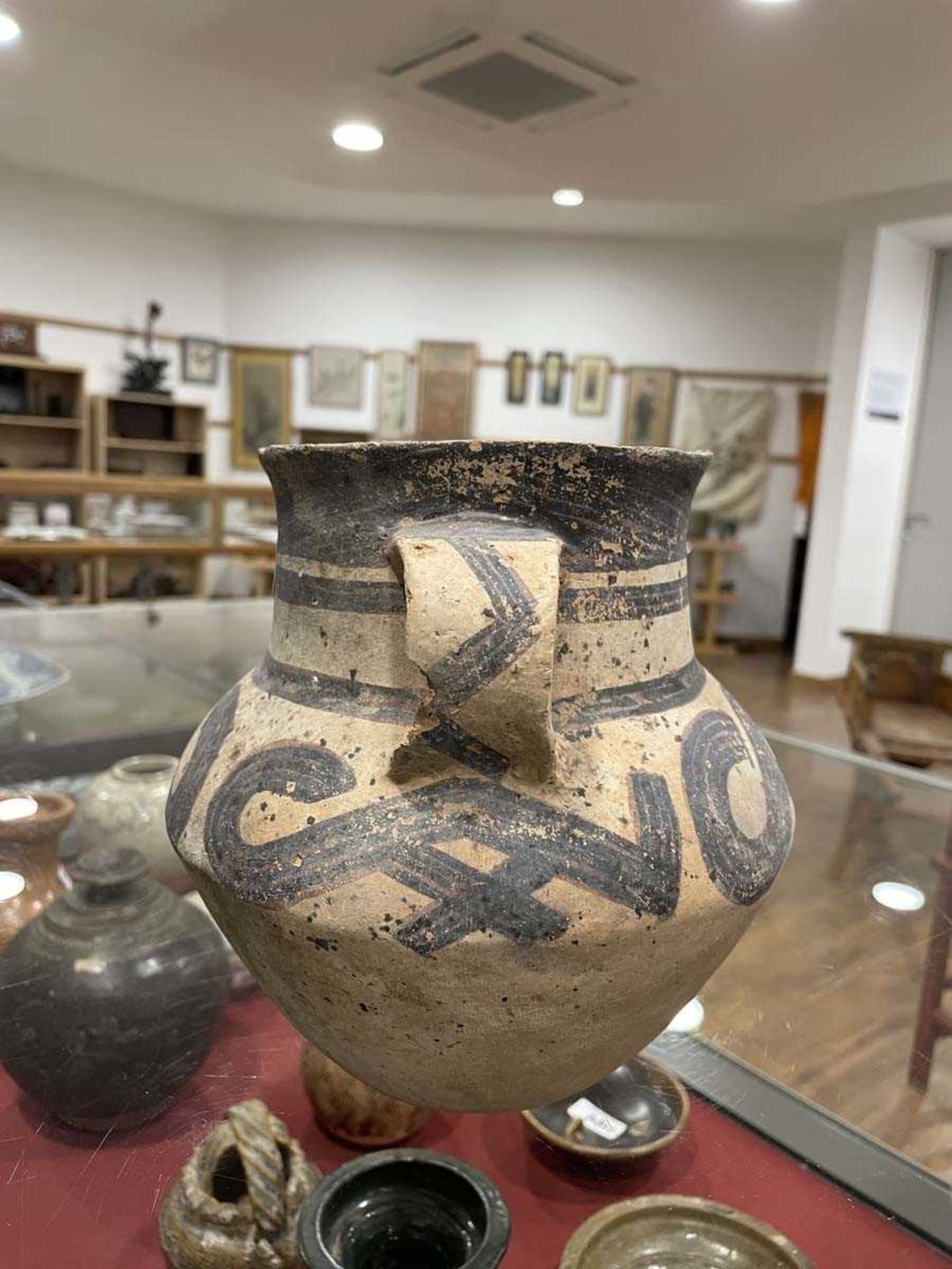 A Chinese archaic pottery two handled vase of typical form decorated in a black glaze, h. 18 cm, - Image 18 of 58