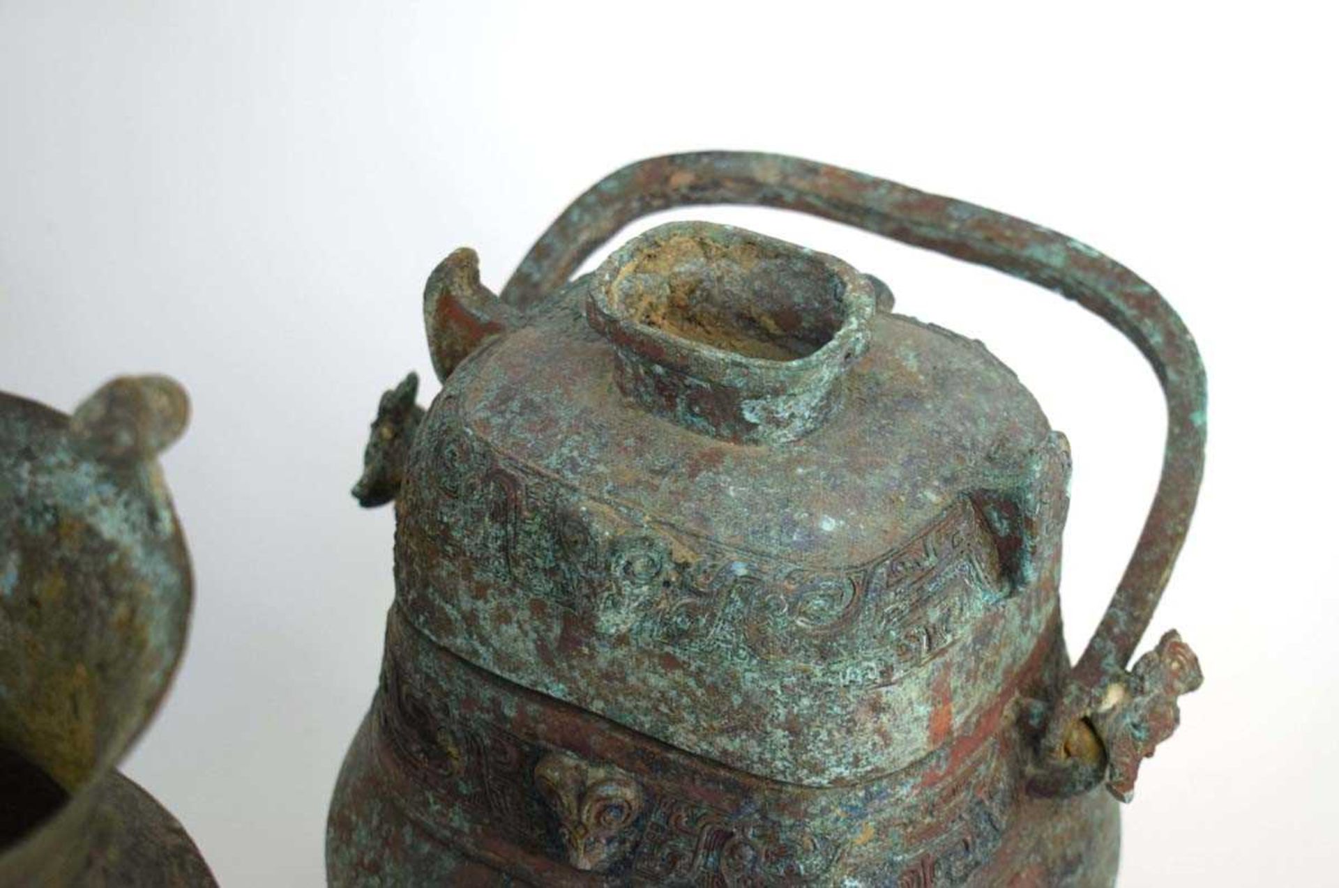 A Chinese green patinated bronze incense burner of tripod form, probably 18th century, h. 21 cm, - Image 4 of 44