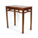 A Chinese pine altar table, the rectangular surface over a fretwork frieze, on four straight legs,