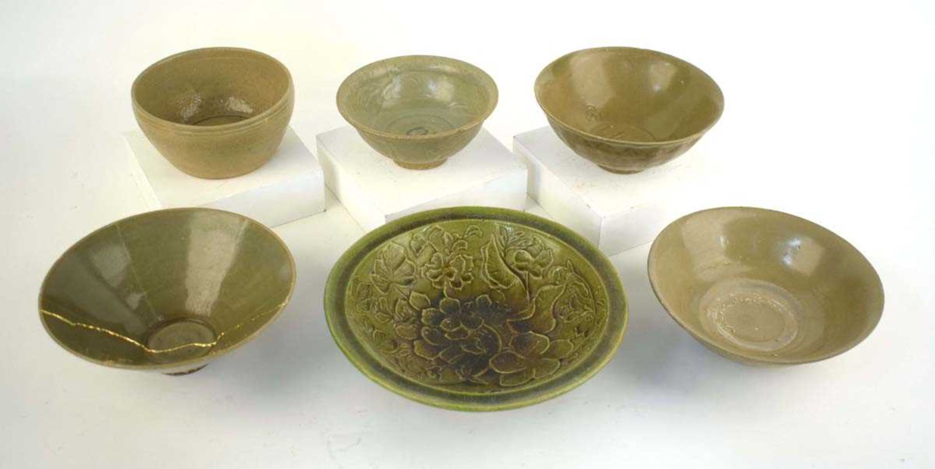 A Chinese celadon bowl of circular form repaired with the Kintsugi technique, d. 19.5 cm, h. 7.5 cm, - Image 2 of 21