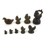 Nine cast metal weights, each modelled as a bird or animal, max h. 9 cm, overall 1846 gms (9) *