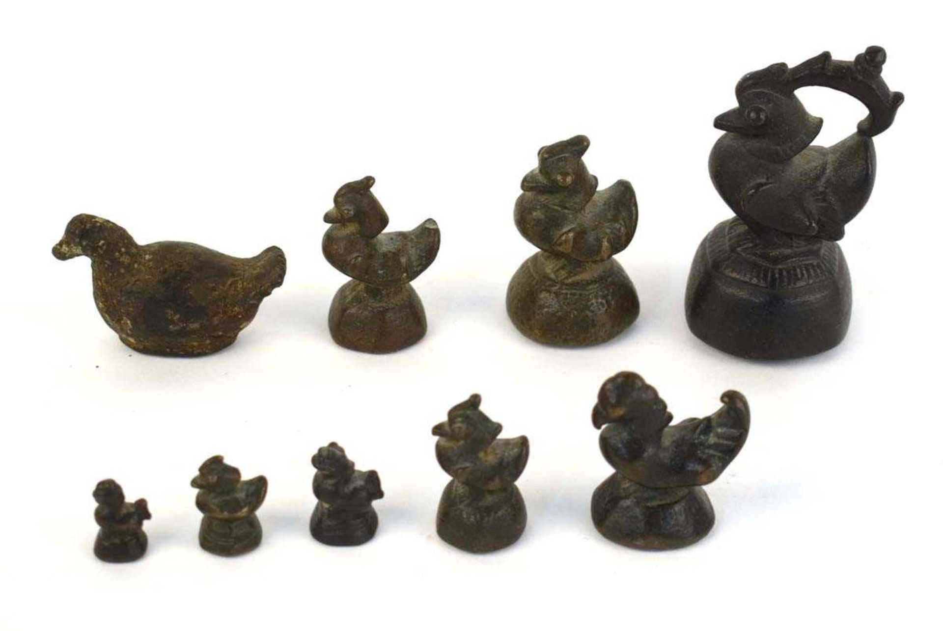 Nine cast metal weights, each modelled as a bird or animal, max h. 9 cm, overall 1846 gms (9) *