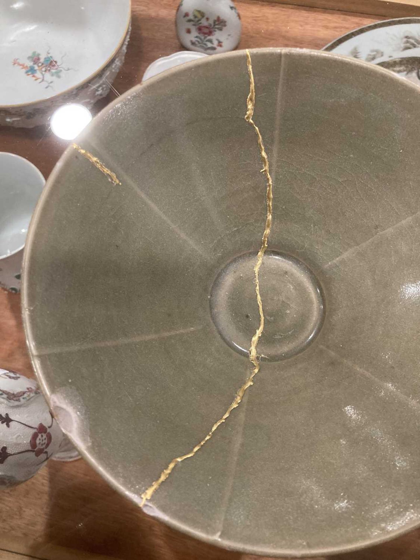A Chinese celadon bowl of circular form repaired with the Kintsugi technique, d. 19.5 cm, h. 7.5 cm, - Image 21 of 21