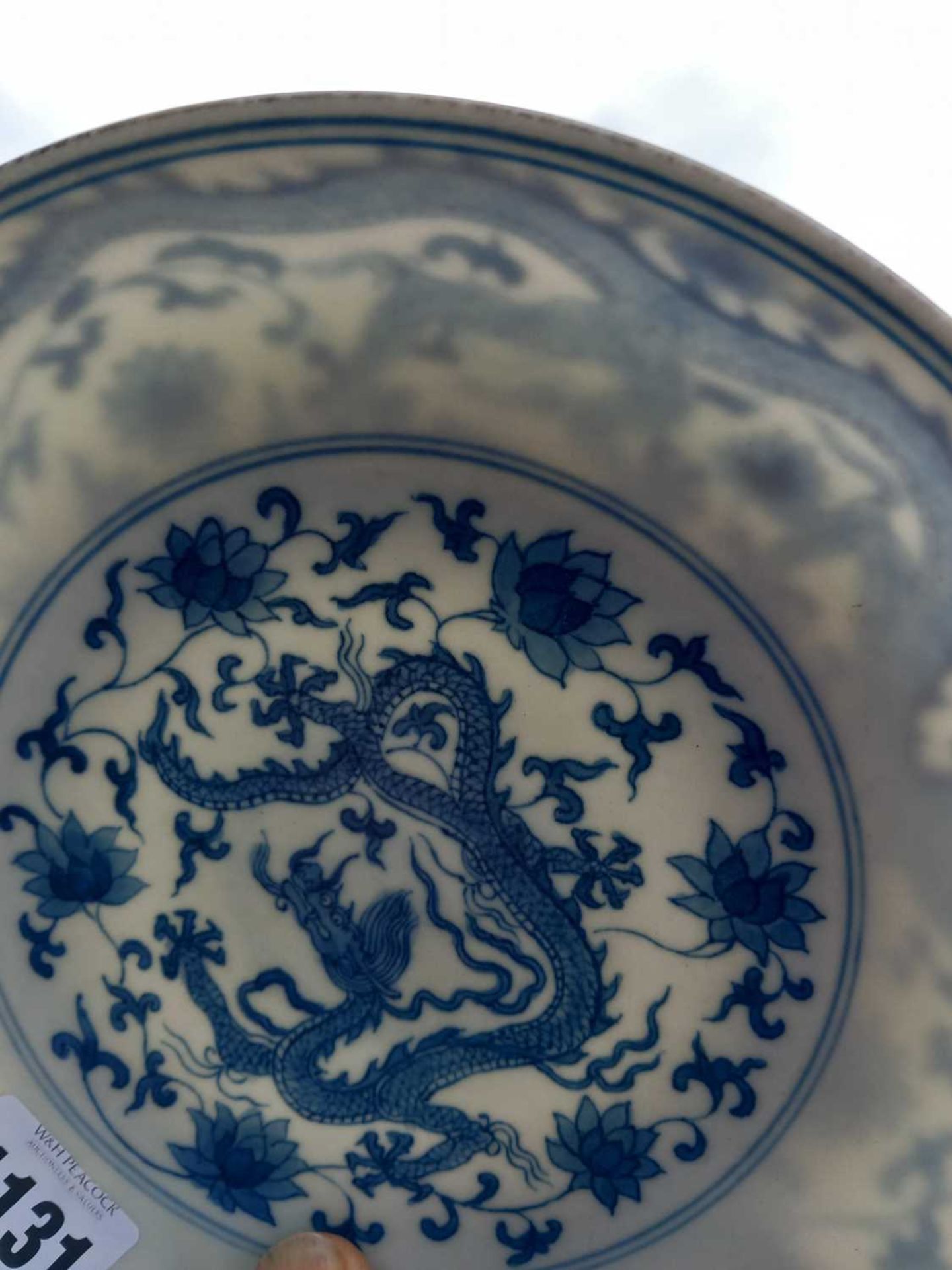 A Chinese blue and white shallow dish, centrally decorated with a dragon and lotus flowers, pseudo - Image 12 of 31