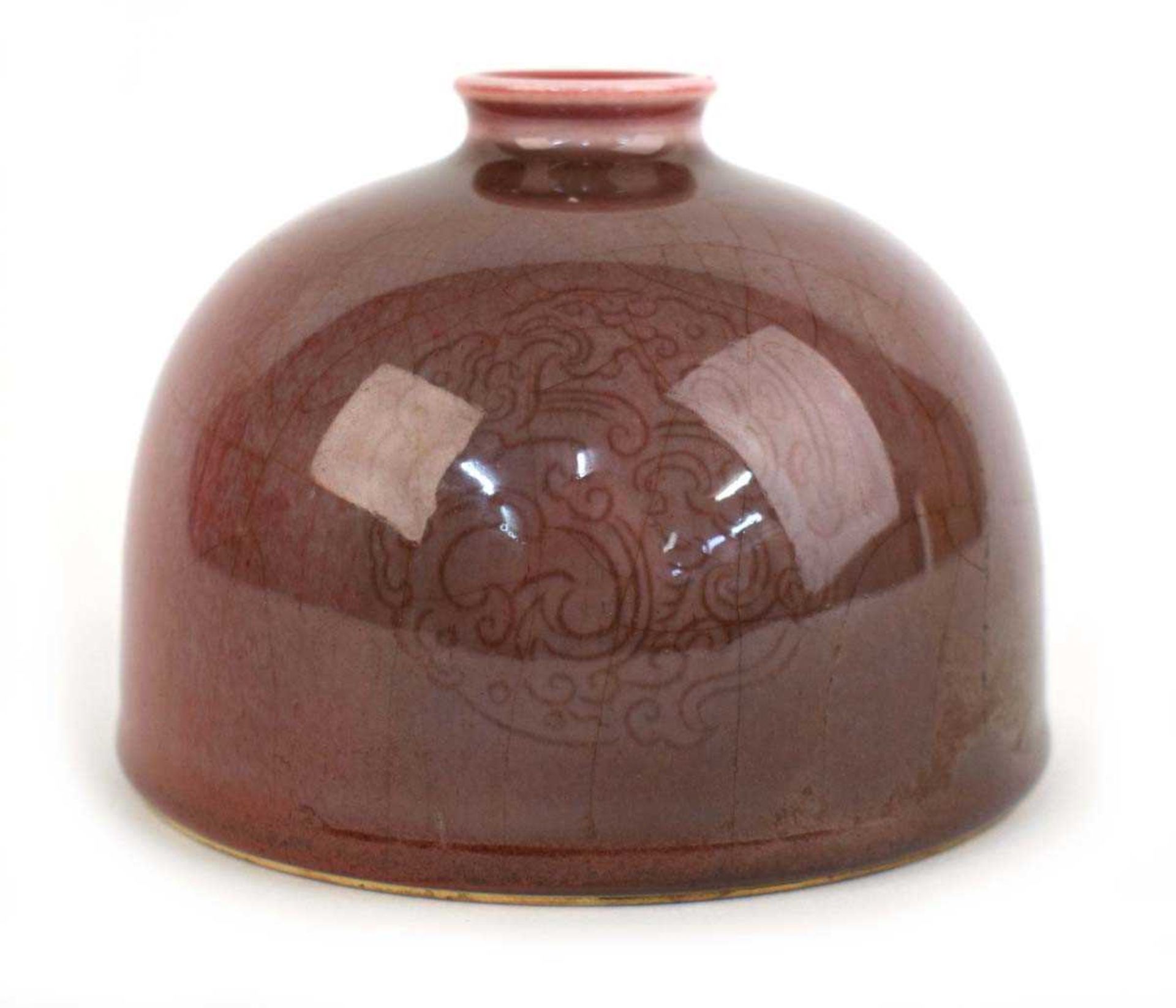 A Chinese sang de boeuf crackle glaze water pot of squat form, Kangxi mark to base, h. 9 cm, d. 12.5