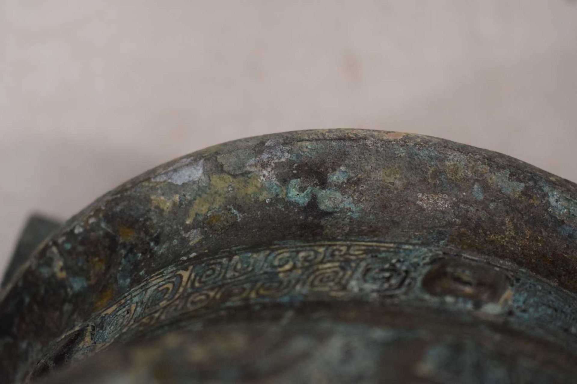 A Chinese green patinated bronze incense burner of archaic form, the triform base decorated with - Image 20 of 29