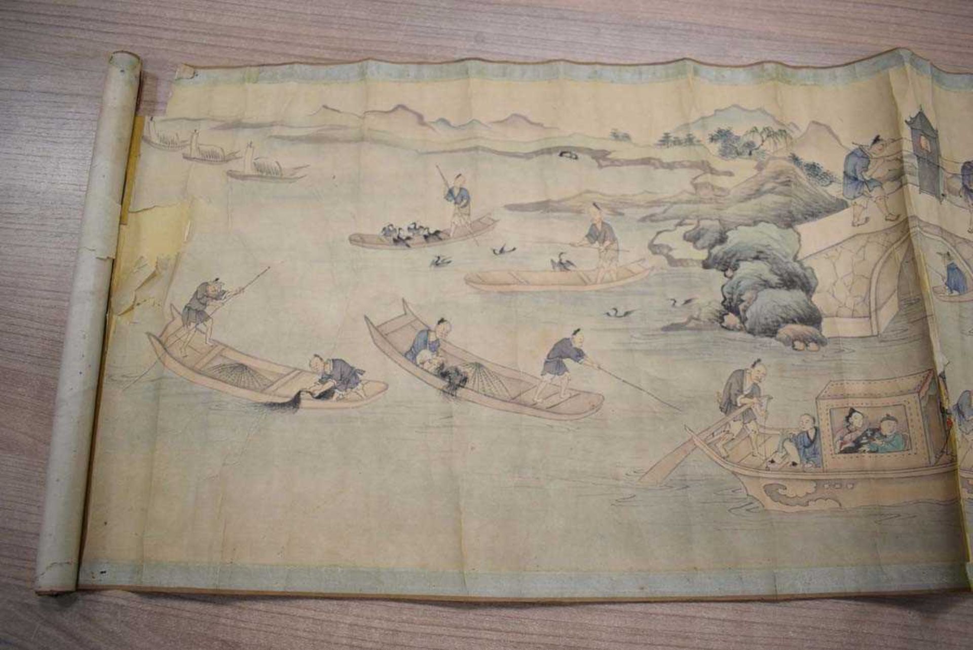A Chinese scroll decorated with an extensive landscape, approx. 240 x 31cm, together with gilt