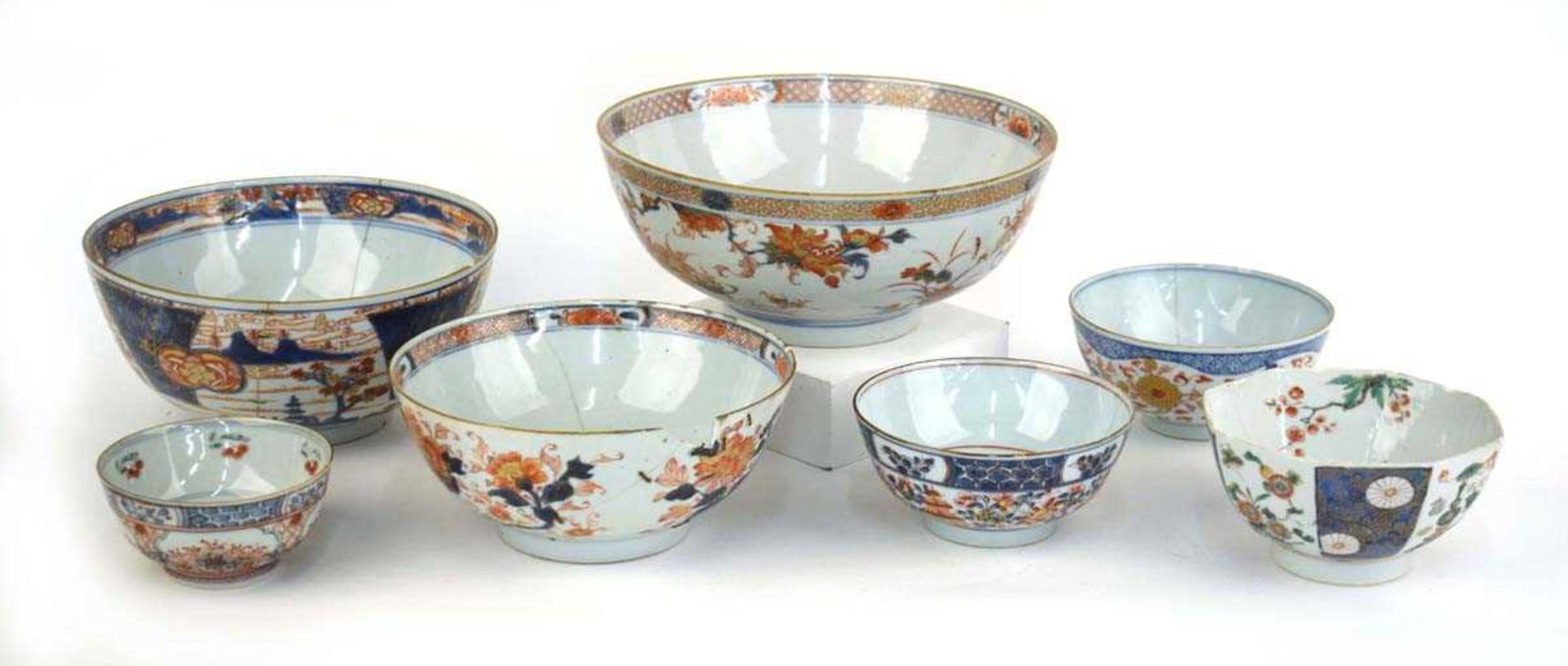 A Chinese bowl centrally decorated with a vase of flowers in the Imari palette, d. 25.5 cm, together