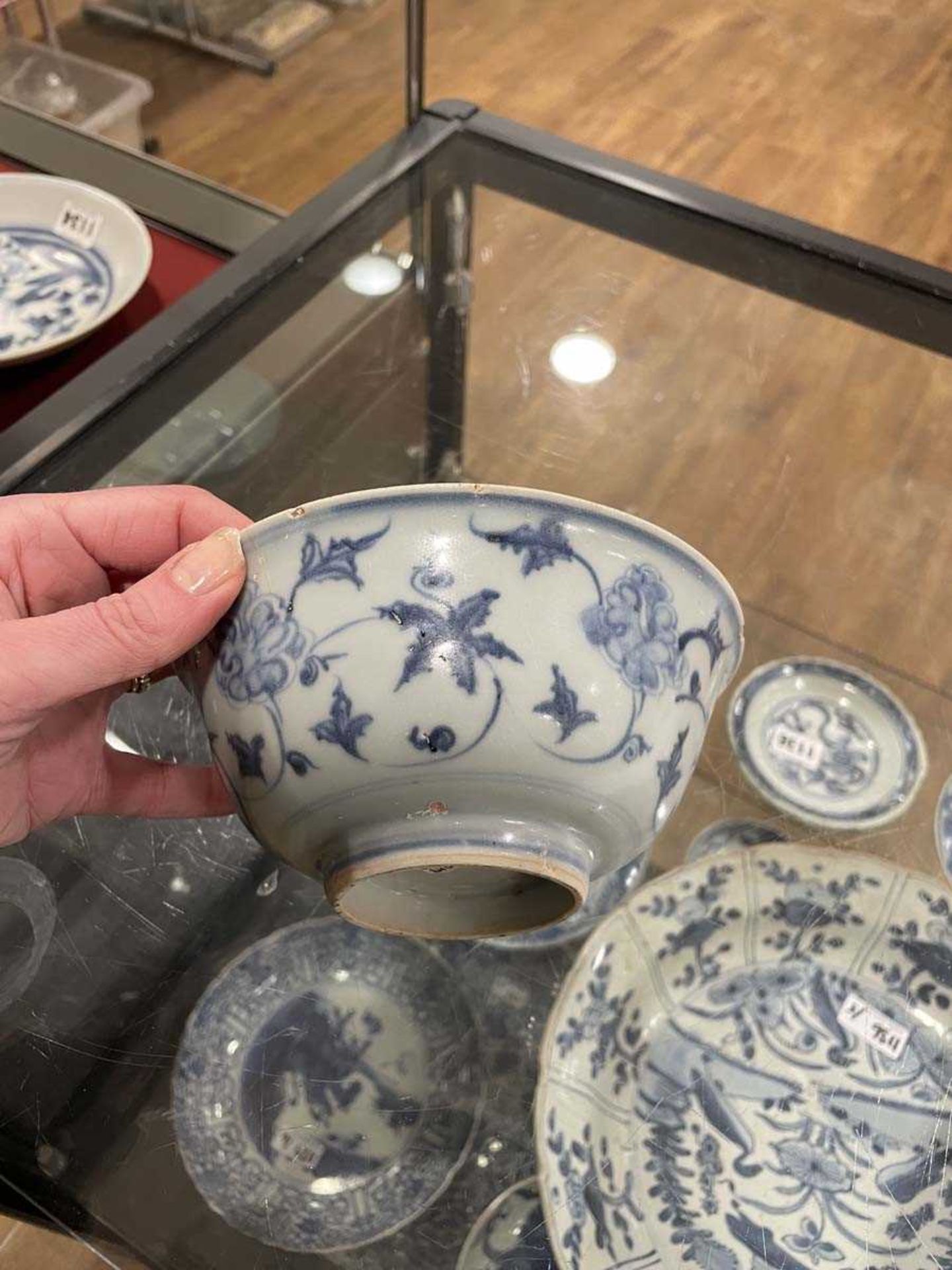 A Chinese blue and white bowl of flared form, externally decorated with scrolls of stylised - Image 9 of 22