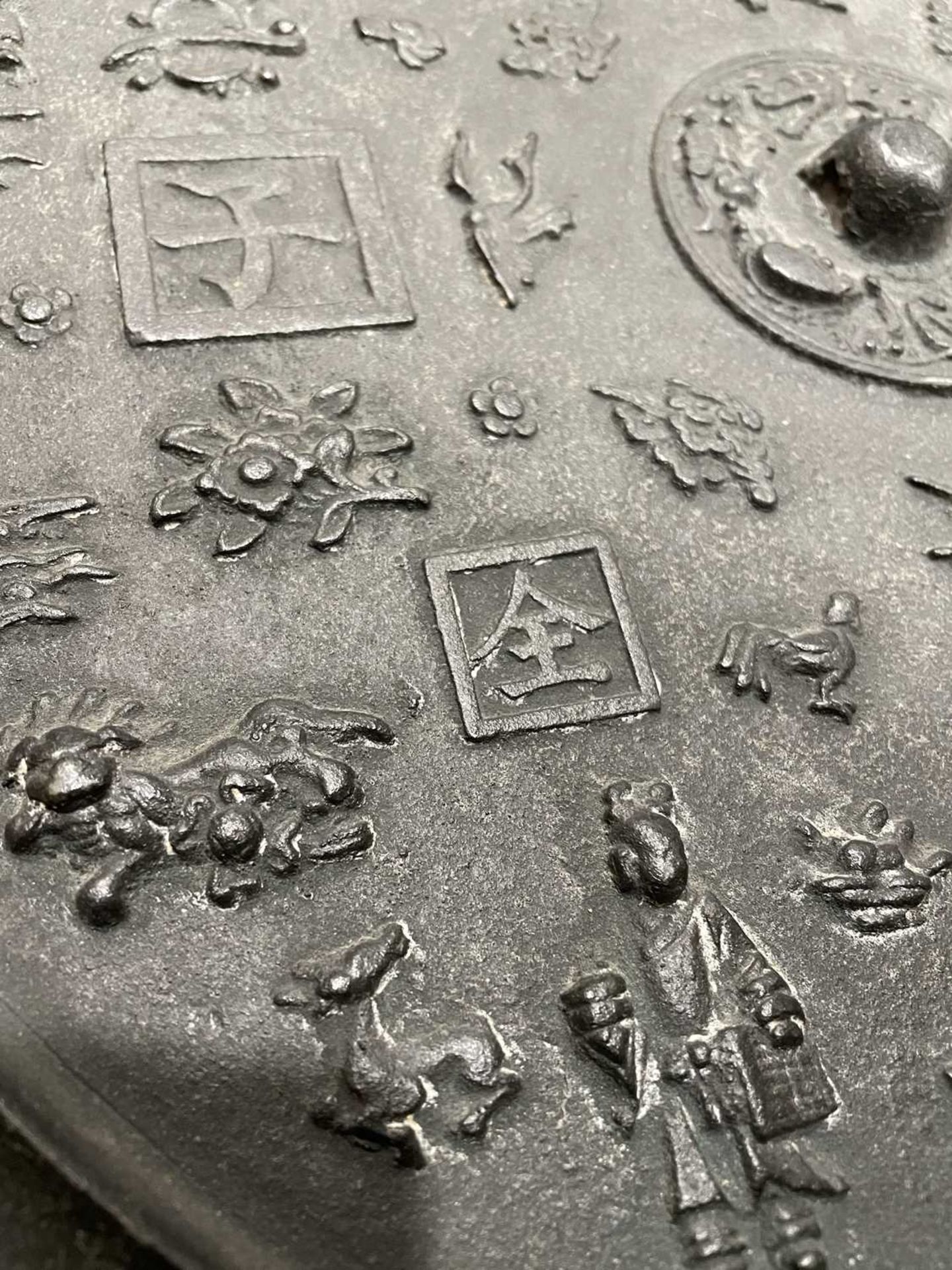 A Chinese Export cast metal 'mirror', relief decorated with figures and characters, d. 40.5 cm, - Image 19 of 25