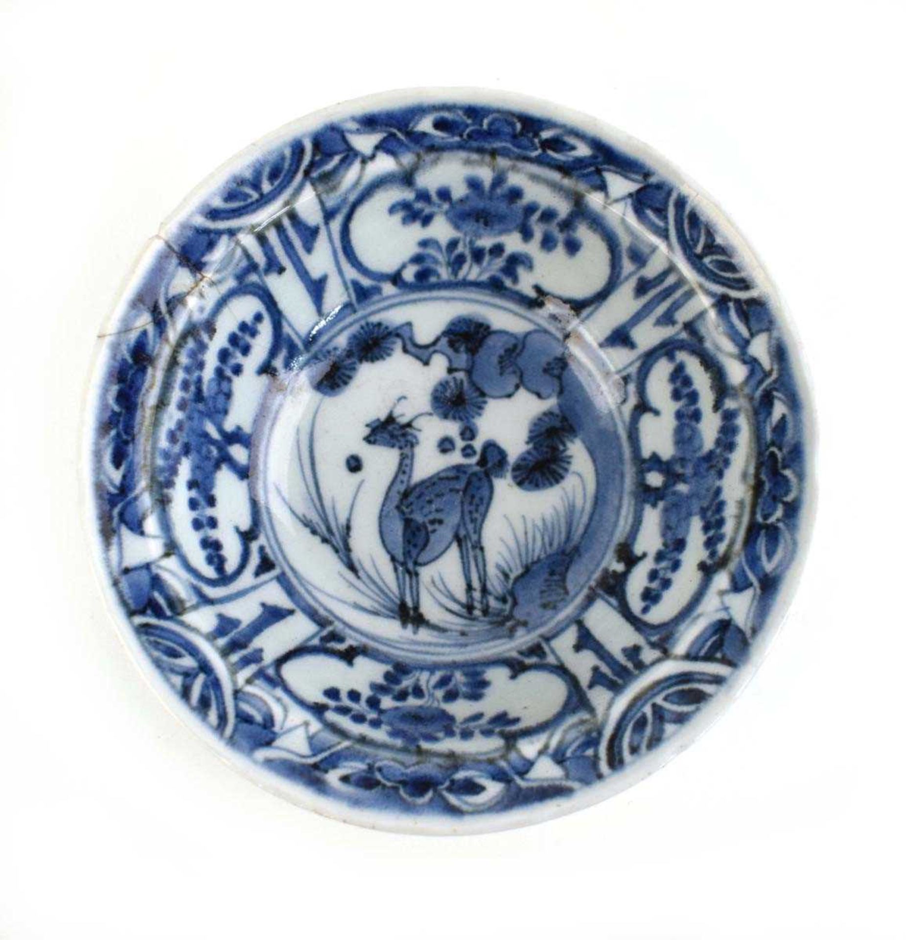 A 17th century Chinese blue and white bowl centrally decorated with a deer amongst a pine tree, d.