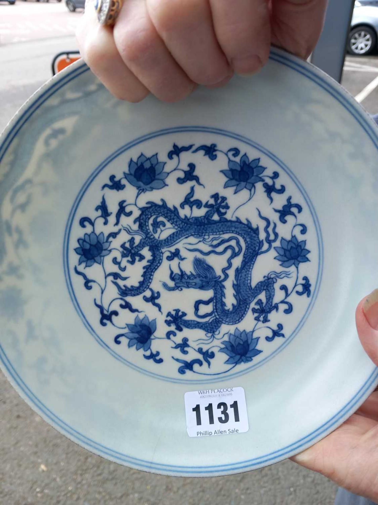 A Chinese blue and white shallow dish, centrally decorated with a dragon and lotus flowers, pseudo - Image 7 of 31