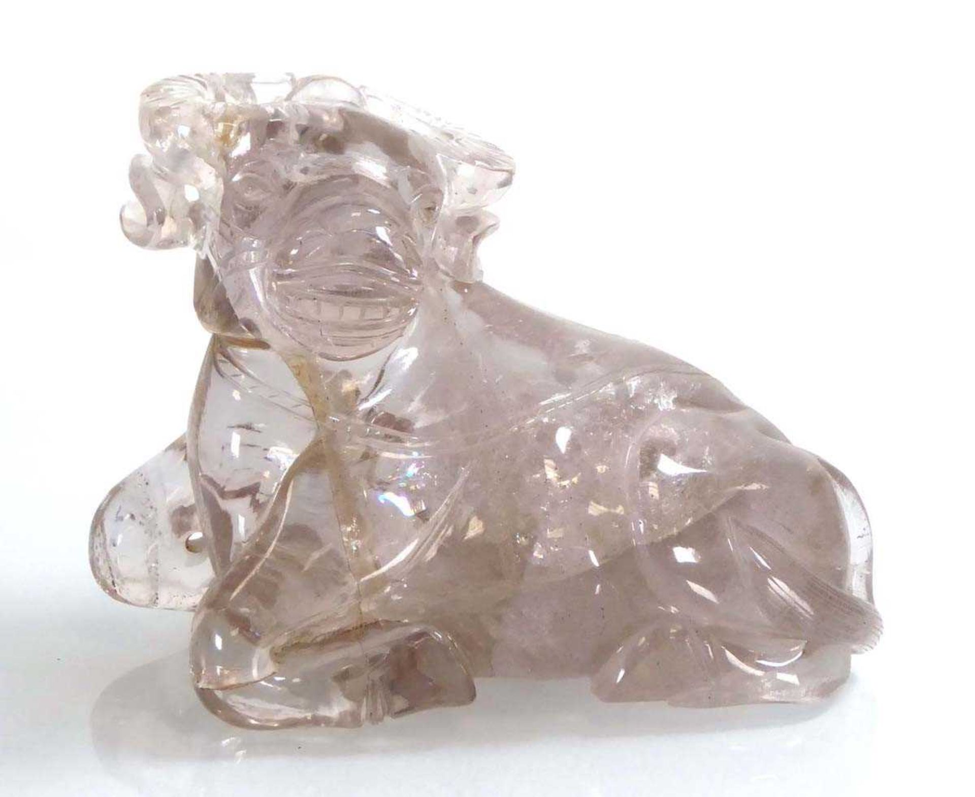 A Chinese clear (?)rock crystal figure modelled as a seated water buffalo, h. 11.5 cm *from the