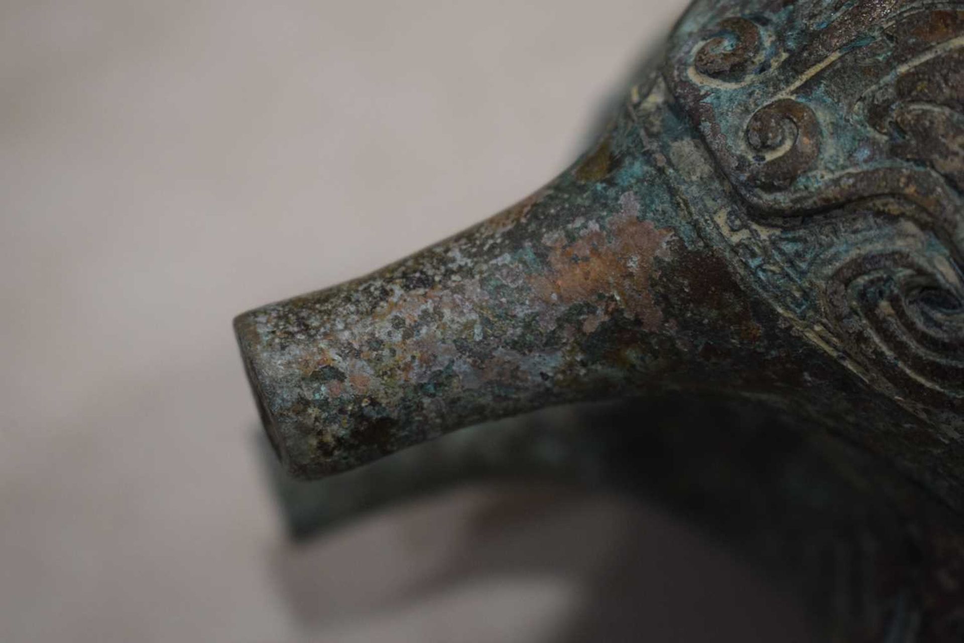 A Chinese green patinated bronze incense burner of archaic form, the triform base decorated with - Image 17 of 29
