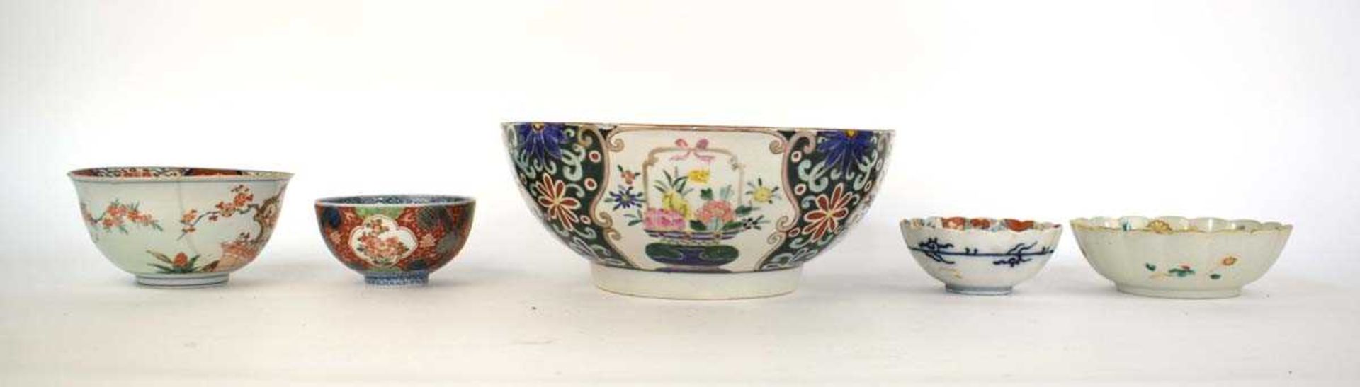 A Japanese Export bowl decorated in coloured enamels with vases of flowers, d. 30.5 cm and four