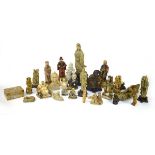 Twenty-five Chinese carved soapstone and other figures including an example of Guanyin, h. 35.5