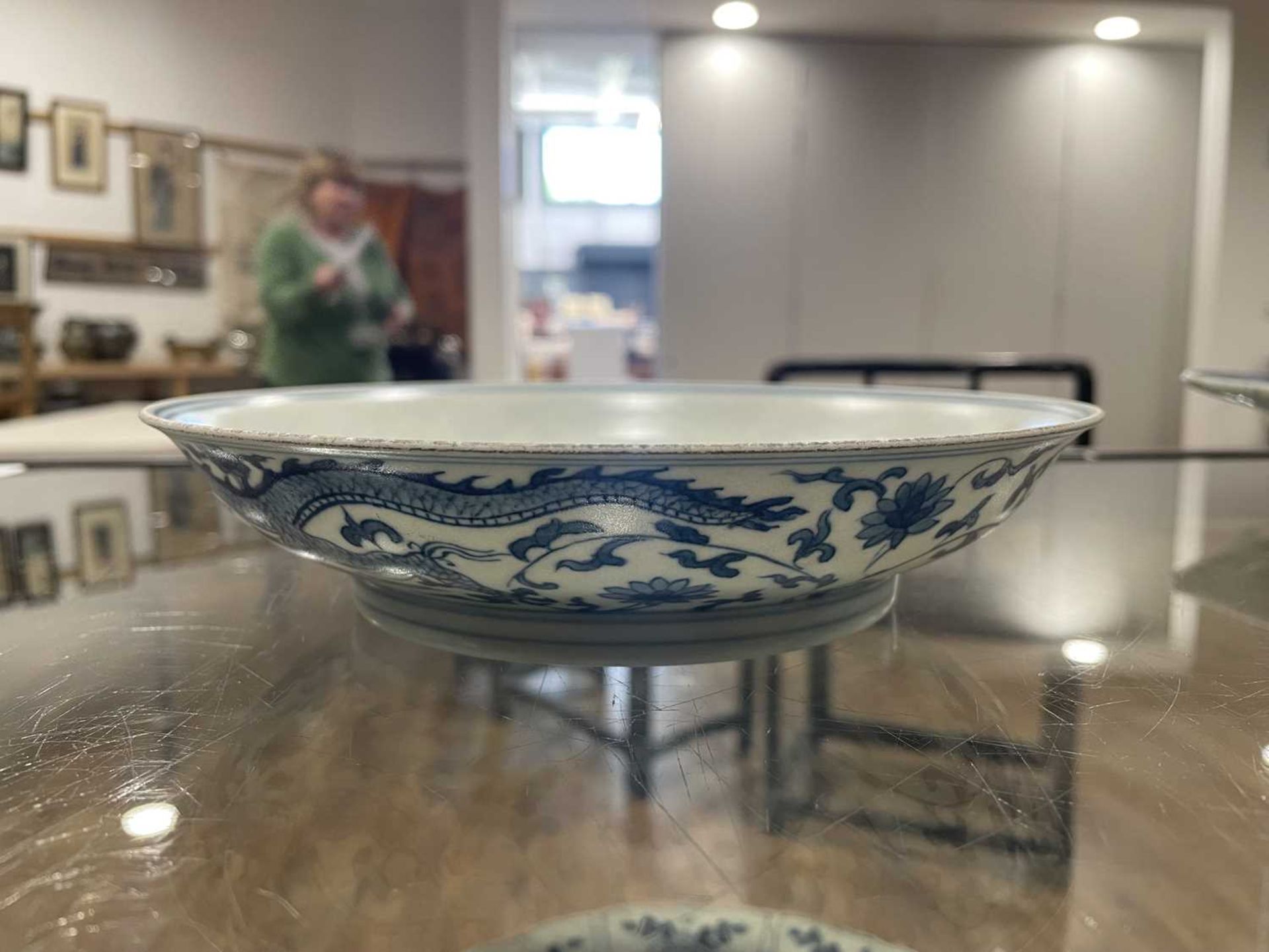 A Chinese blue and white shallow dish, centrally decorated with a dragon and lotus flowers, pseudo - Image 30 of 31