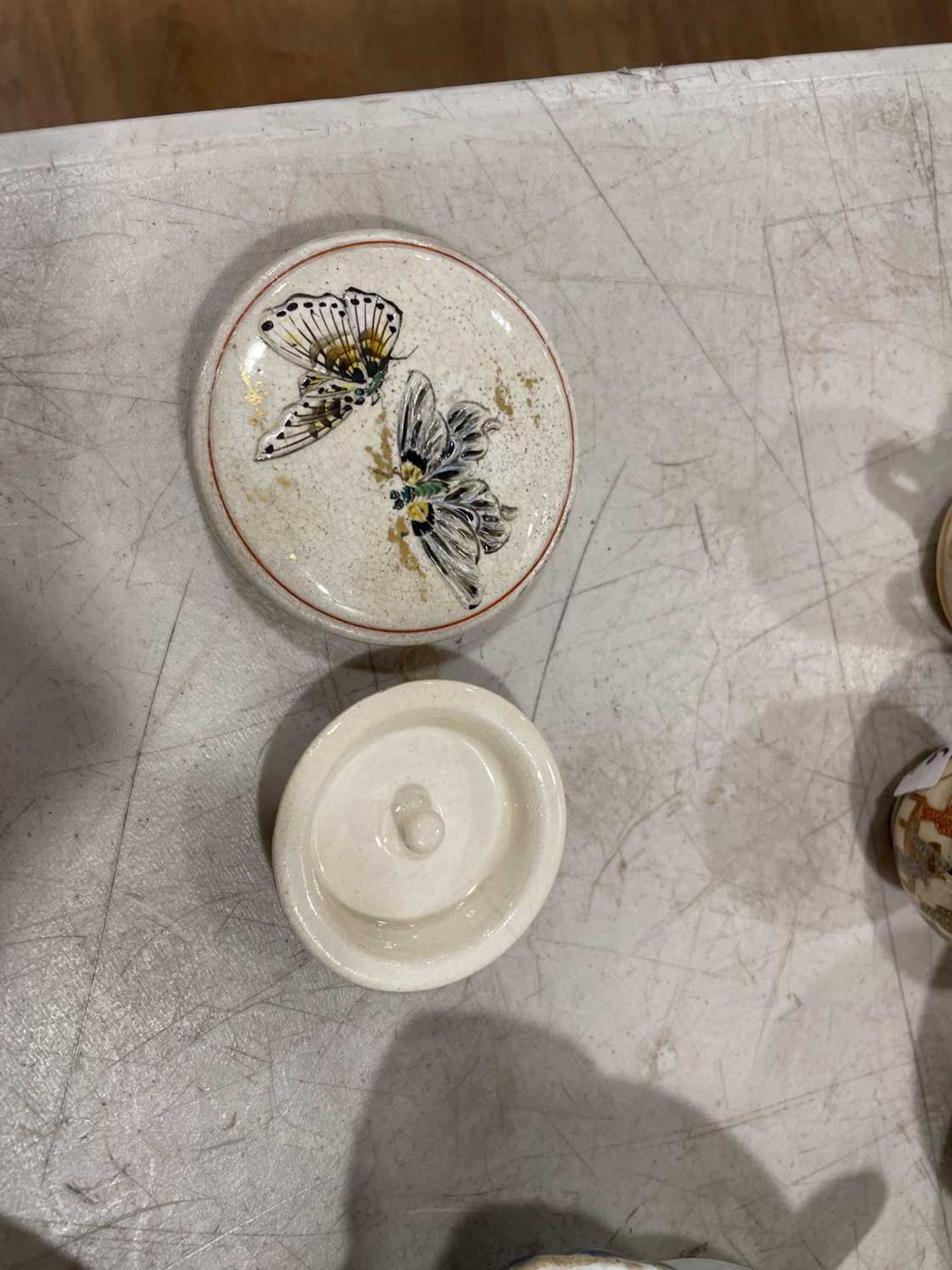 A Japanese satsuma bowl of flowerhead form, centrally decorated with peacocks within a landscape, - Image 5 of 41