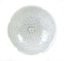 A small Chinese shallow celadon dish of flowerhead form decorated with stylised foliate motifs, d.