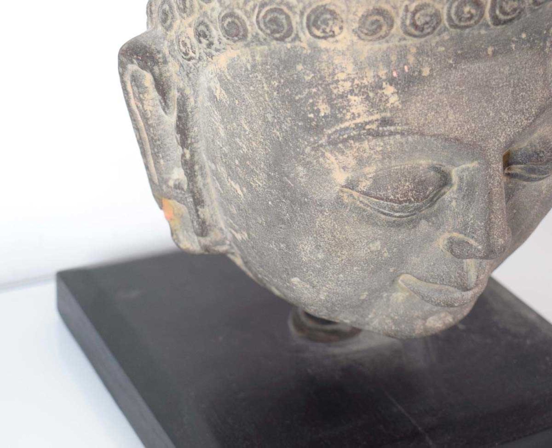 A stoneware figure modelled as the Buddhas head, h. 38.5 cm, including stand *from the collection of - Bild 2 aus 6