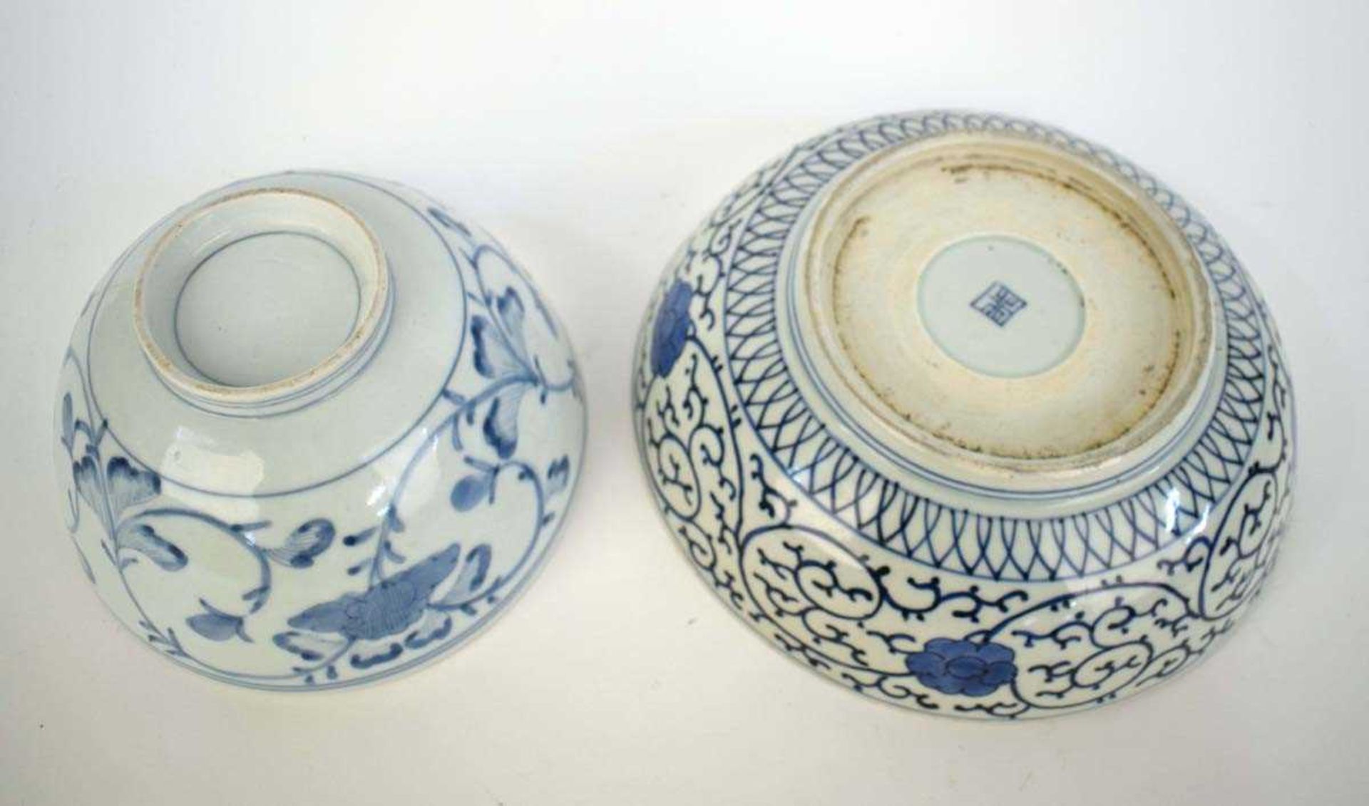 A Japanese blue and white bowl, centrally decorated with a shrubs within a scrolled border, - Image 3 of 12