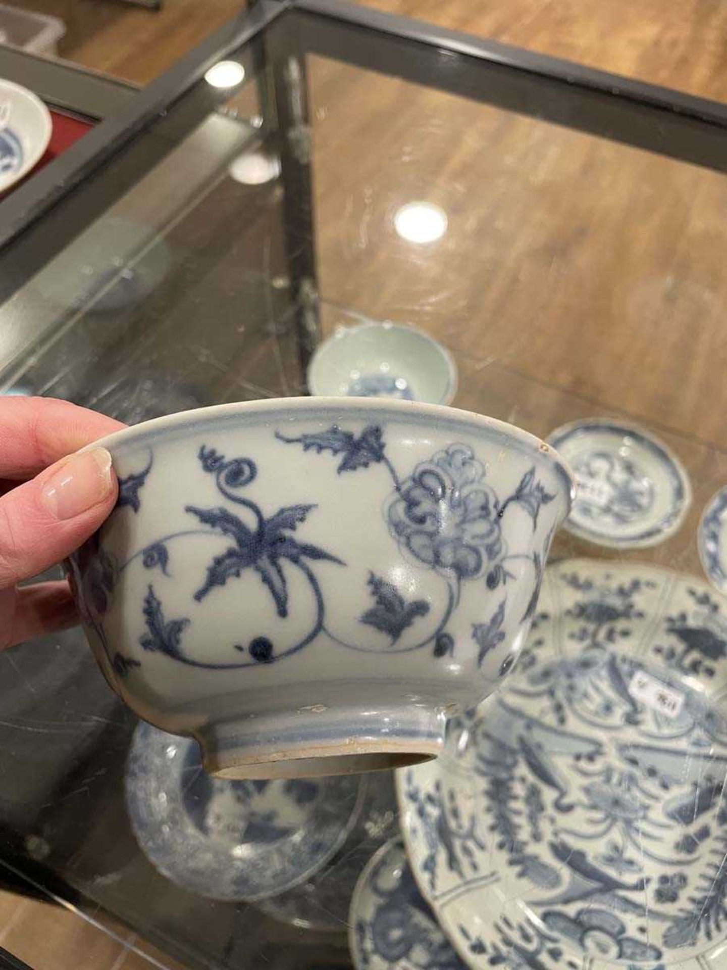 A Chinese blue and white bowl of flared form, externally decorated with scrolls of stylised - Image 16 of 22