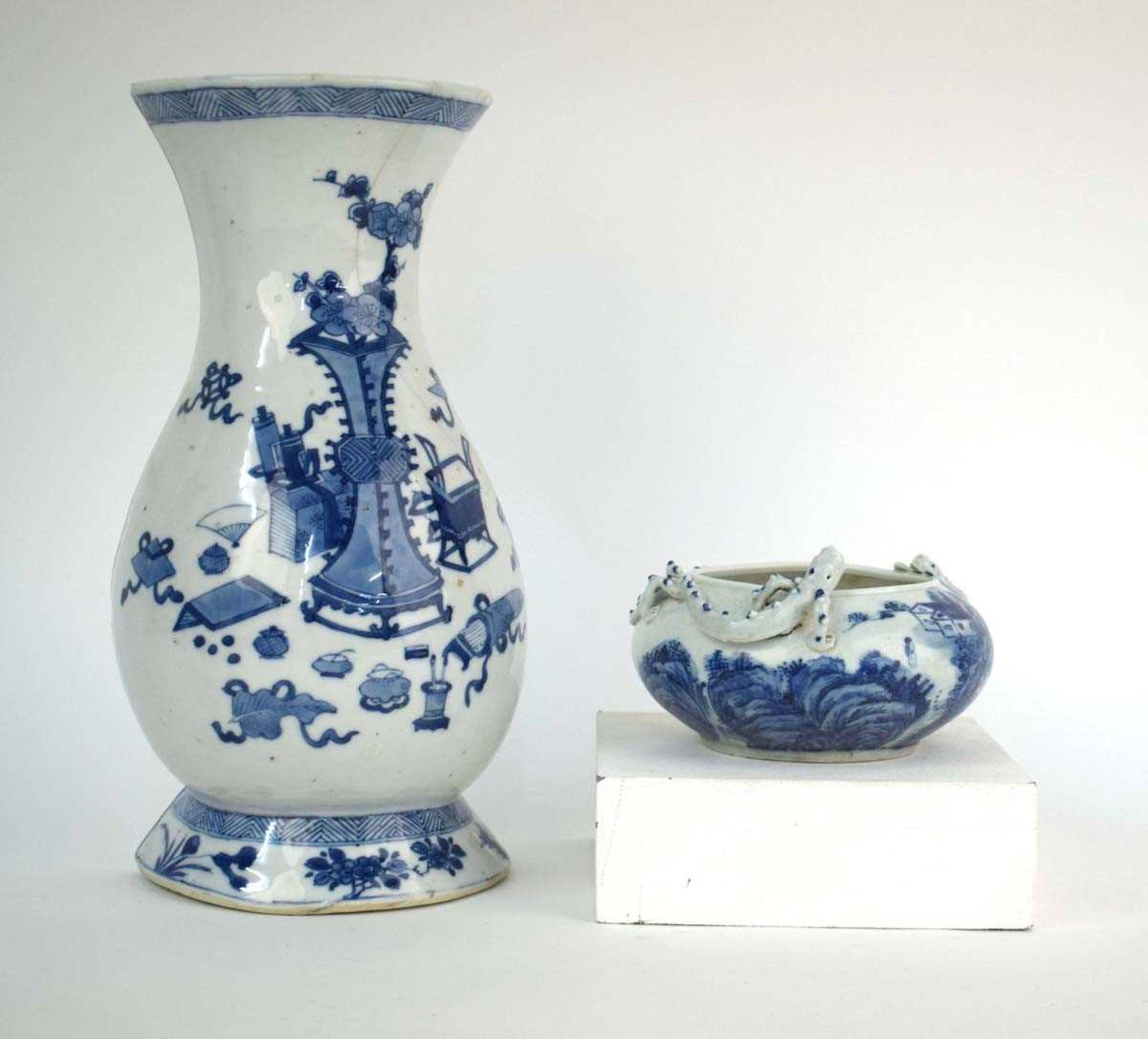 A Chinese blue and white wall pocket of vase shaped form, decorated with objects and prunus blossom,