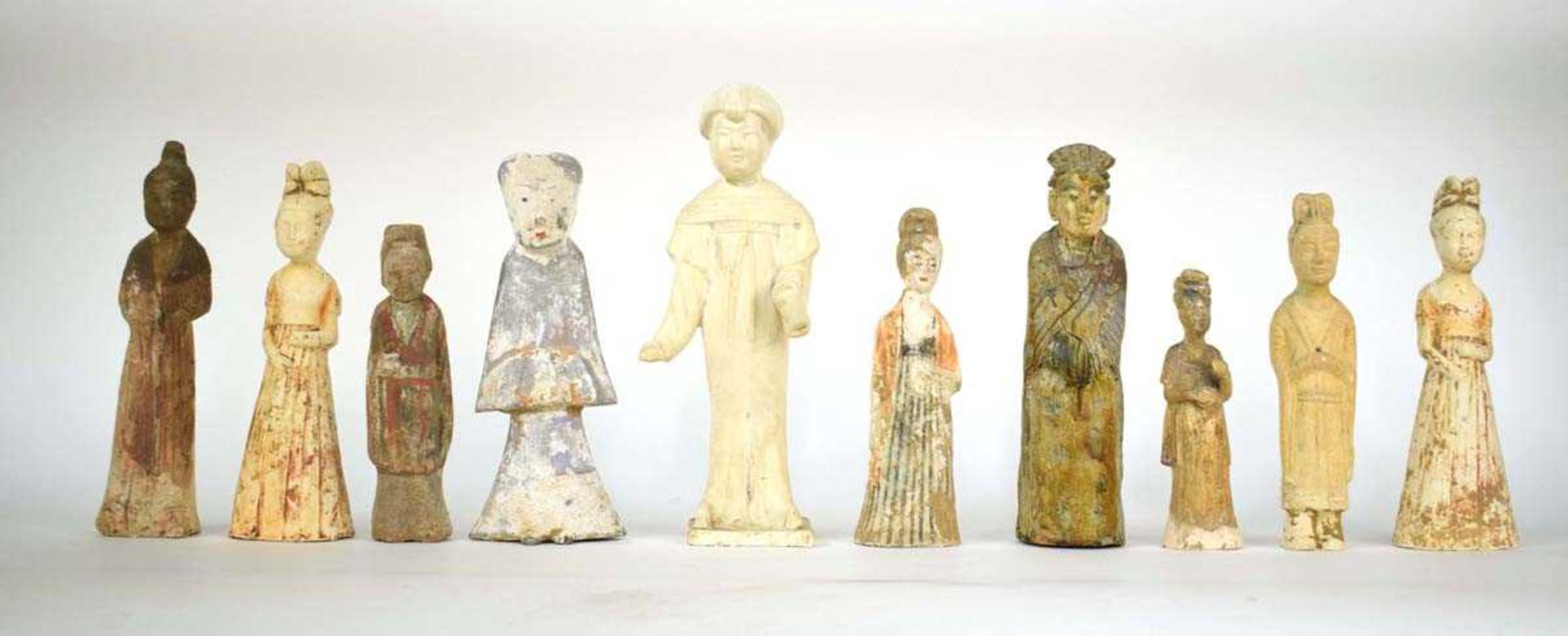 Ten Chinese pottery tomb and other figures, decorated in various glazes, max h. 35 cm, together with
