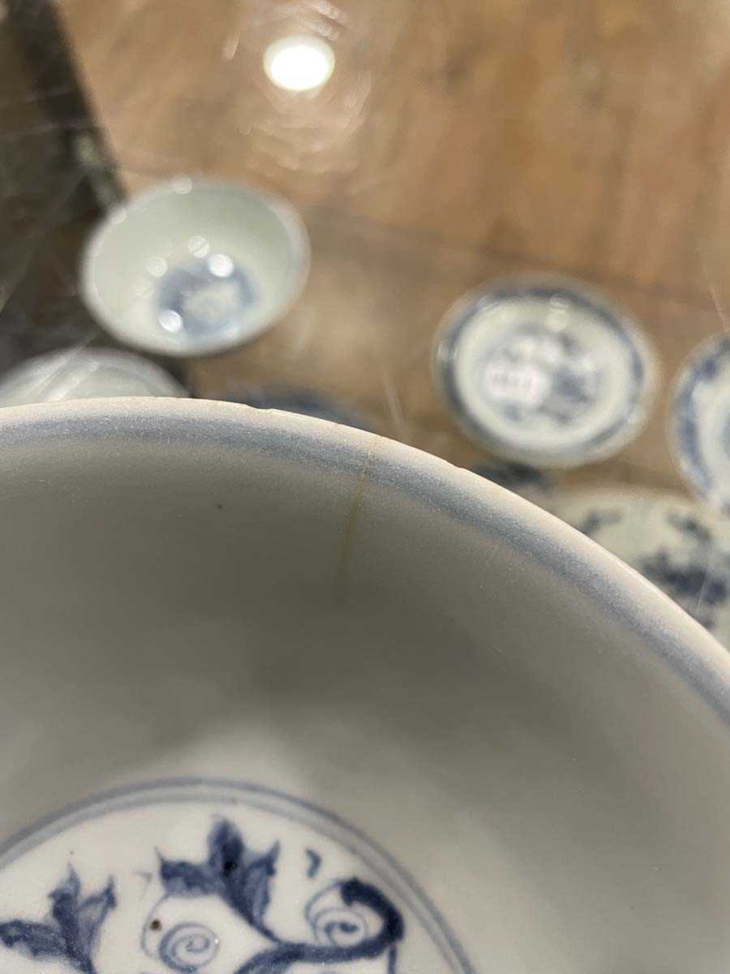 A Chinese blue and white bowl of flared form, externally decorated with scrolls of stylised - Image 14 of 22