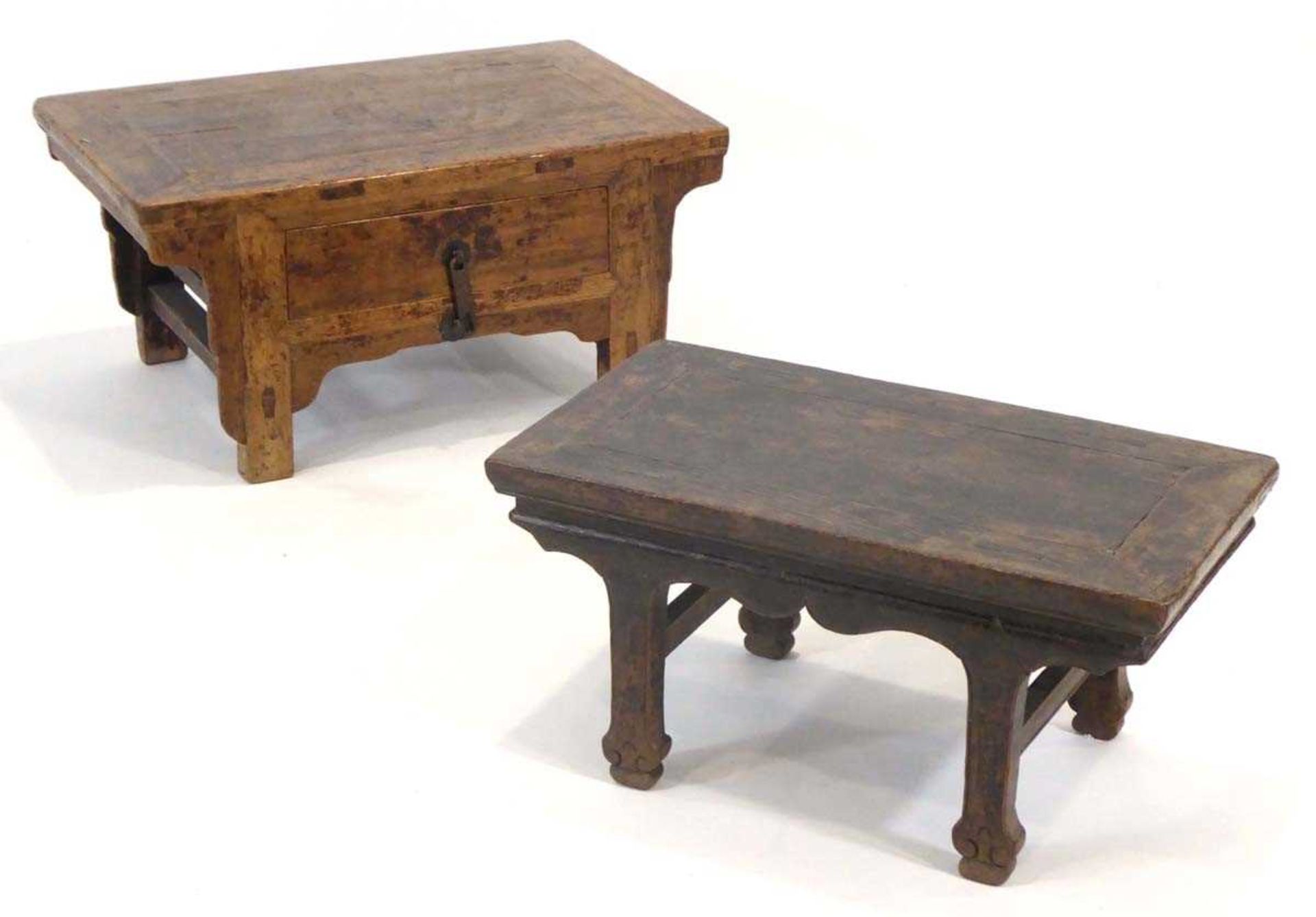 A Chinese low elm side table, the surface over a frieze on four shaped legs, 64 x 35 x 31 cm,