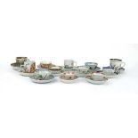 Twelve matching Chinese and other tea bowls, cups and saucers, each decorated in a different