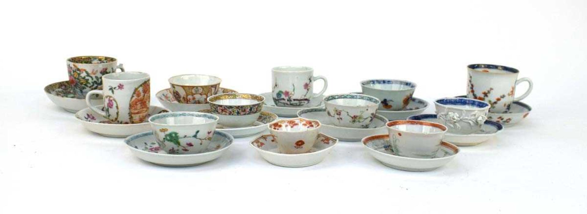 Twelve matching Chinese and other tea bowls, cups and saucers, each decorated in a different