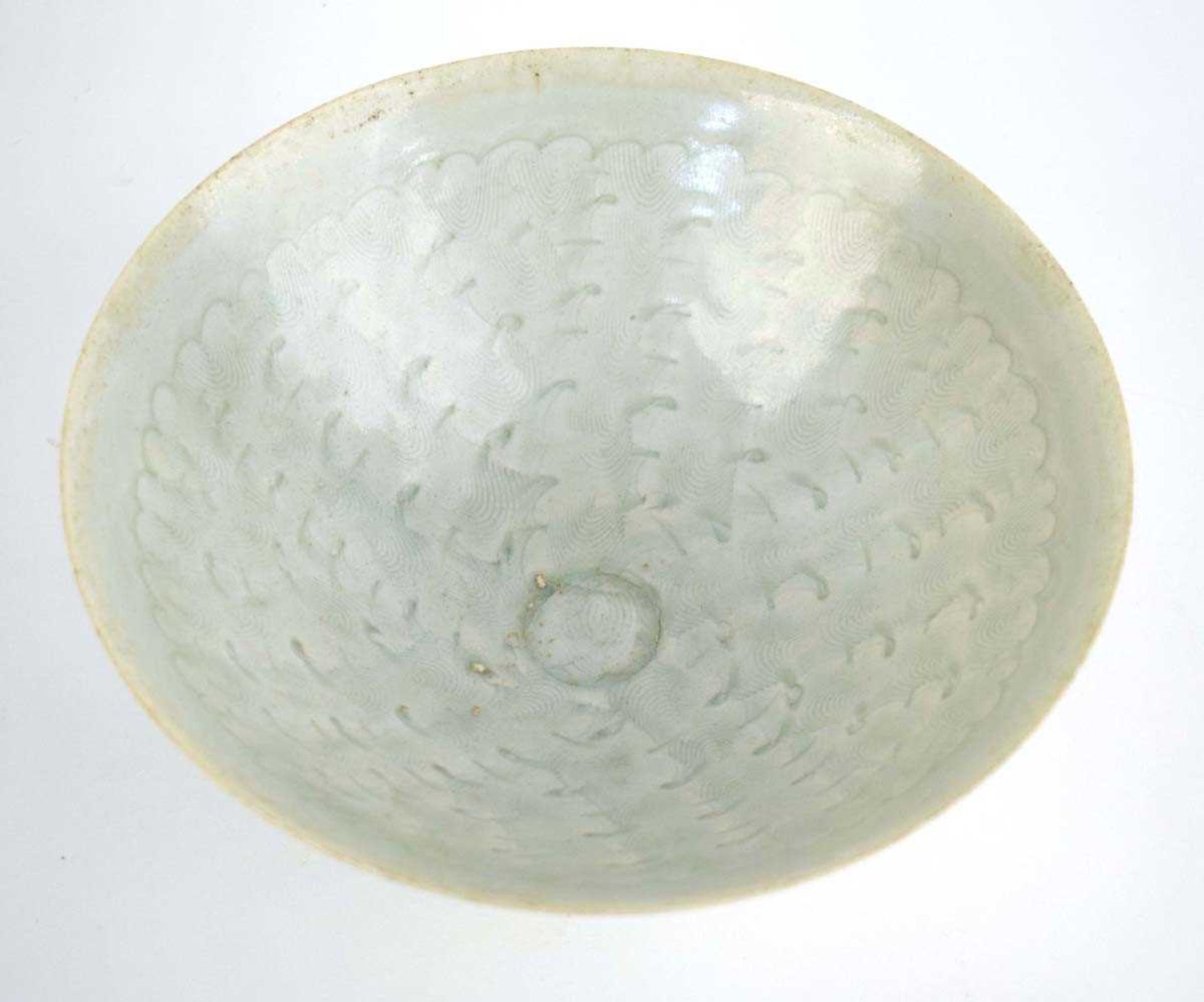 A Chinese celadon bowl of flared circular form, relief decorated with cloud like motifs, d. 20.5 cm, - Bild 3 aus 8