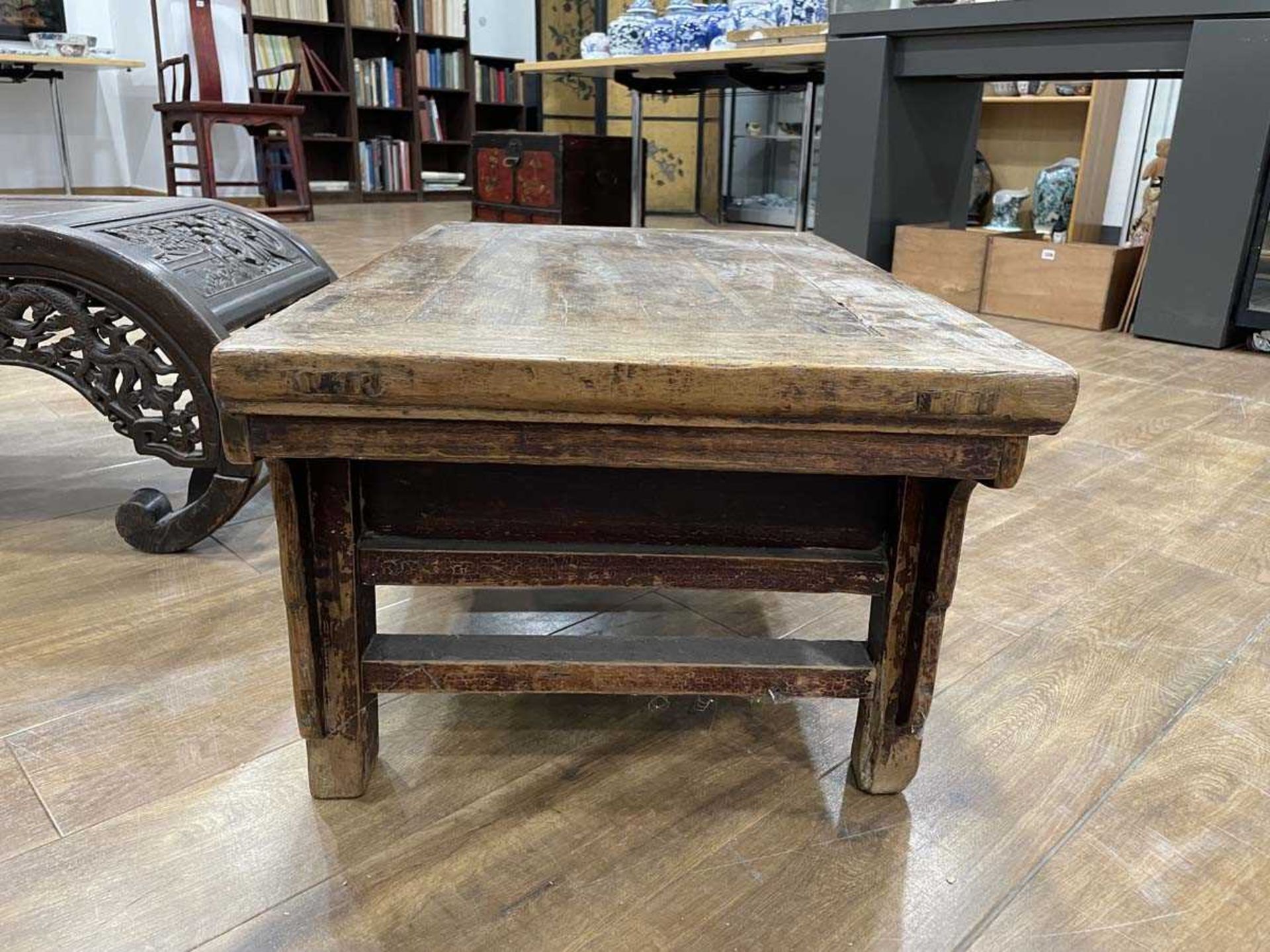 A Chinese low elm side table, the surface over a frieze on four shaped legs, 64 x 35 x 31 cm, - Bild 12 aus 15