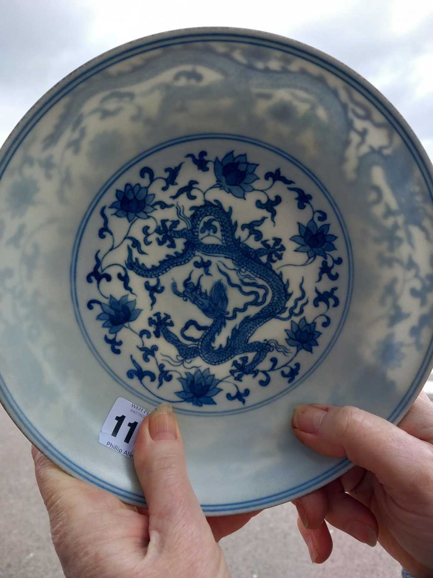 A Chinese blue and white shallow dish, centrally decorated with a dragon and lotus flowers, pseudo - Image 8 of 31