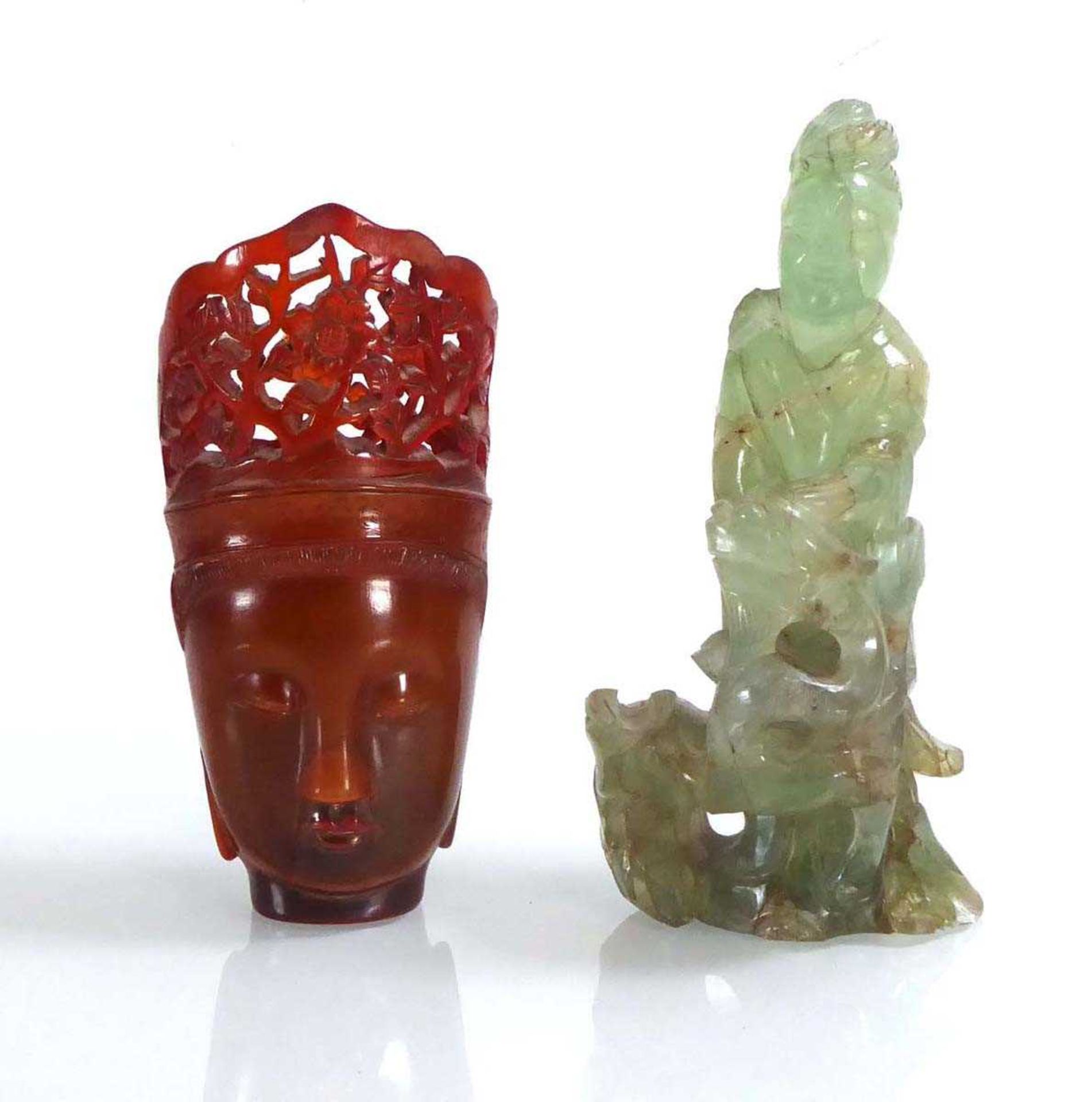 A Chinese green hardstone figure, h. 15 cm and a horn style mask carving, h. 13.5 cm (2) *from the