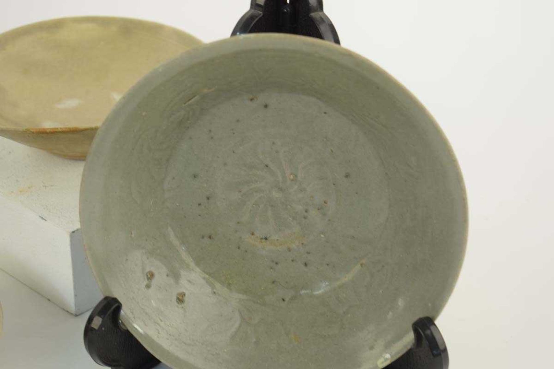 A Chinese celadon tea bowl of circular form repaired with the Kintsugi technique, d. 10.5 cm, h.4. - Image 2 of 4