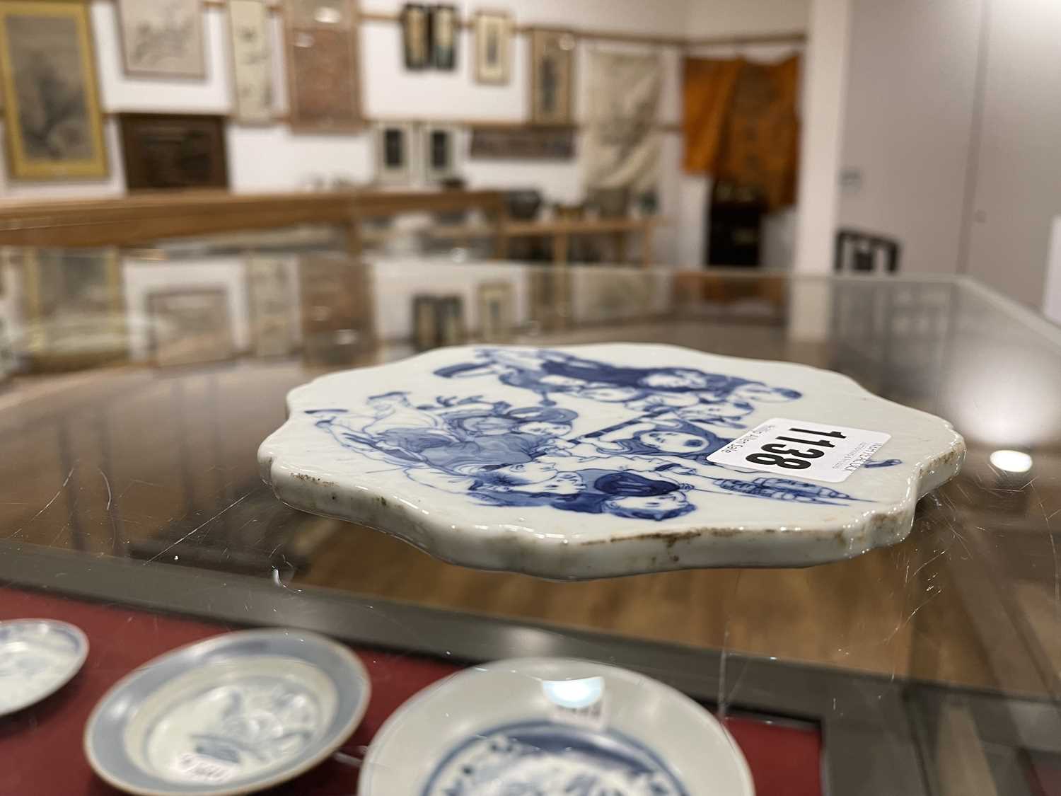 A Chinese blue and white plaque of flowerhead form decorated with children at play, set into a - Image 8 of 20