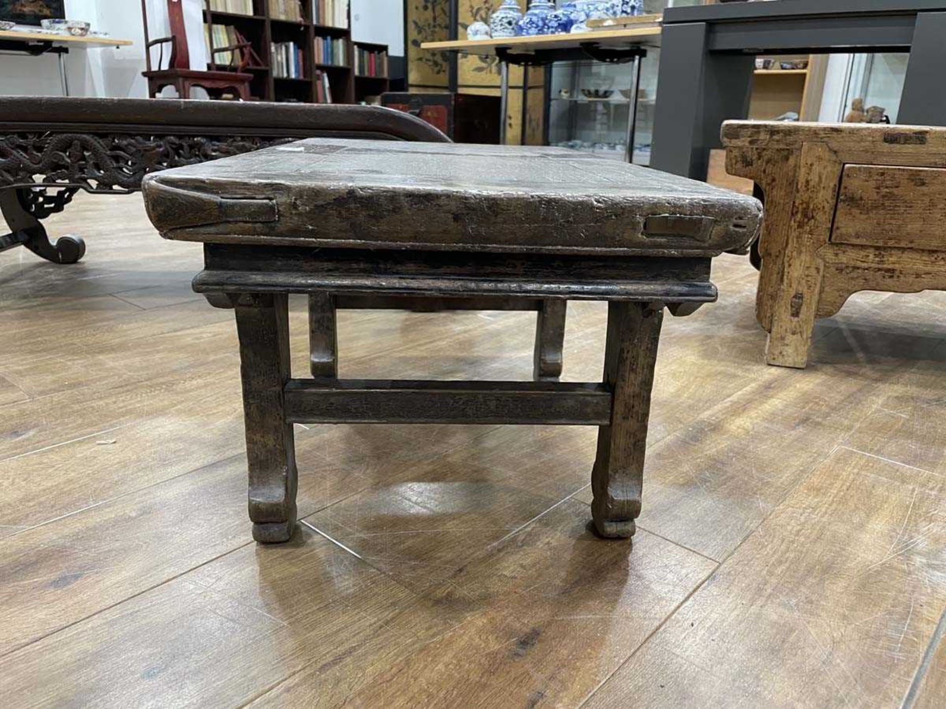 A Chinese low elm side table, the surface over a frieze on four shaped legs, 64 x 35 x 31 cm, - Bild 4 aus 15