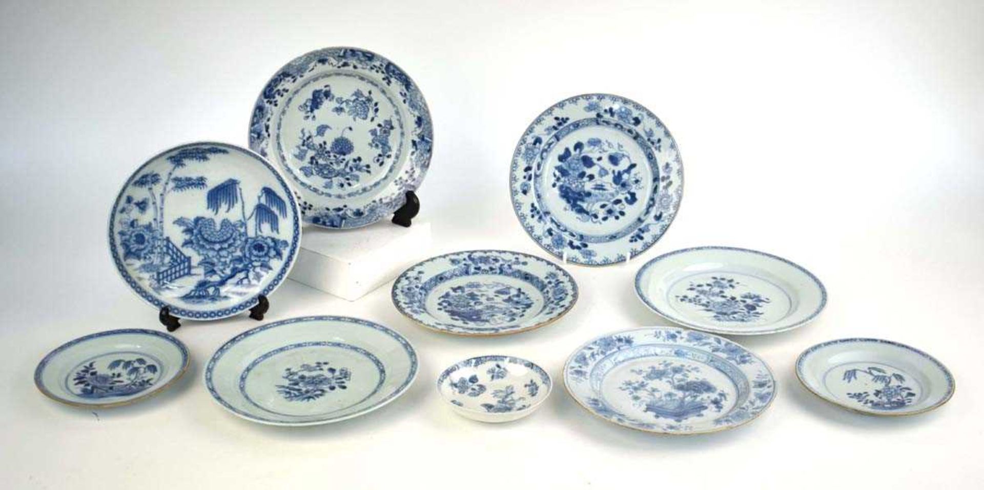 A Chinese blue and white side plate, centrally decorated with floral blooms within a diamond