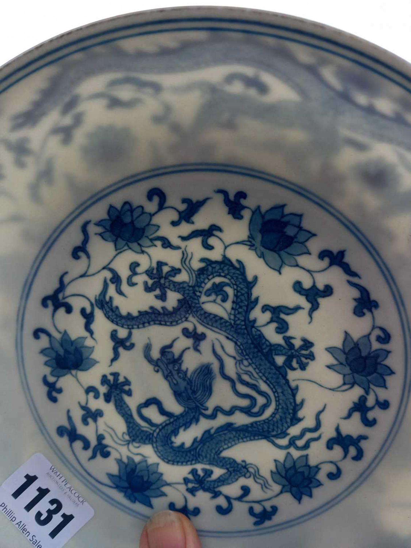 A Chinese blue and white shallow dish, centrally decorated with a dragon and lotus flowers, pseudo - Image 15 of 31