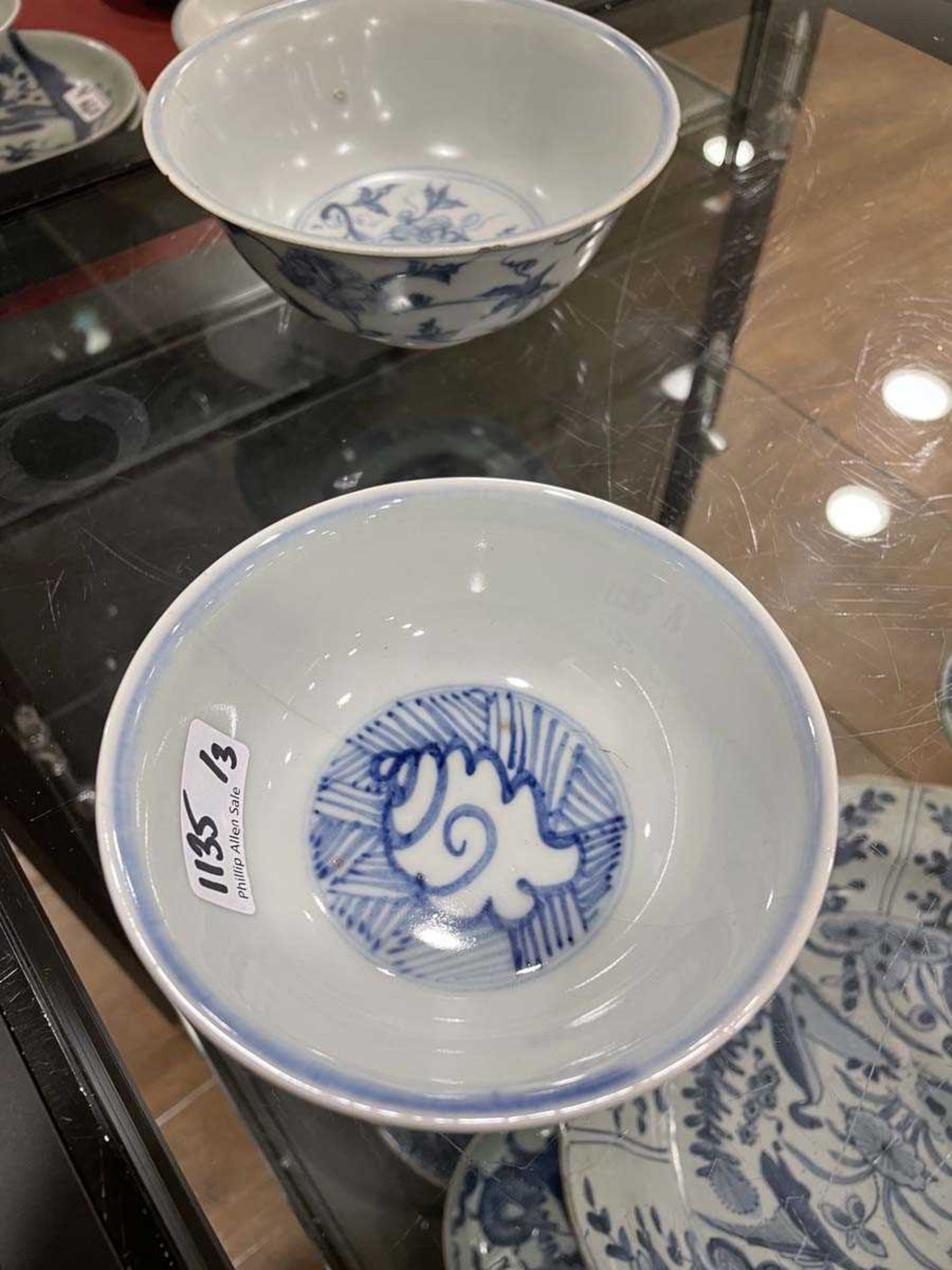 A Chinese blue and white bowl of flared form, externally decorated with scrolls of stylised - Image 21 of 22