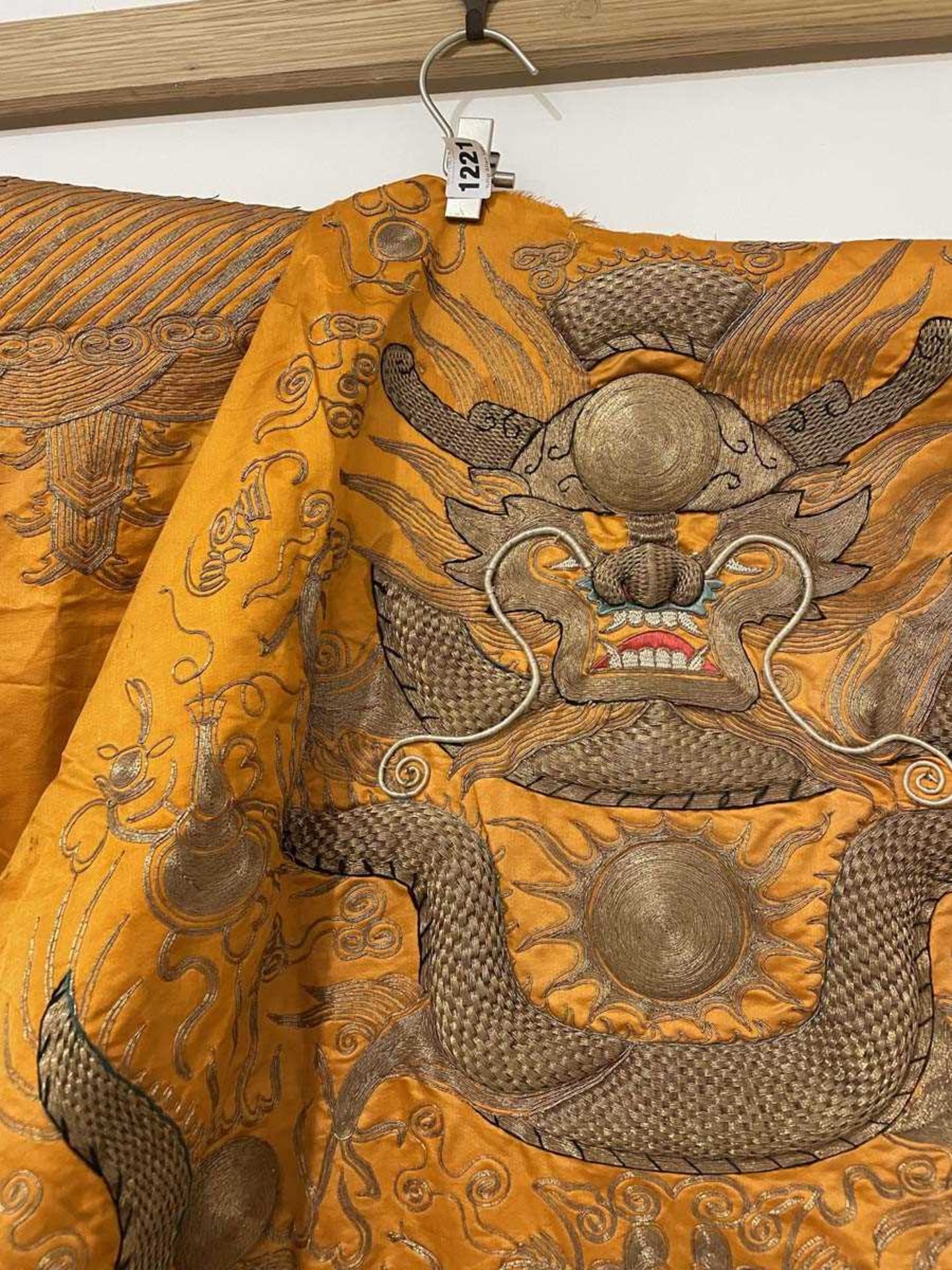A Chinese robe section worked in gold coloured threads depicting dragons and a pagoda on an orange - Bild 3 aus 15