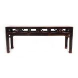 A Chinese hardwood bench of typical form, w. 120 cm, h. 48 cm, d. 32 cm *from the collection of