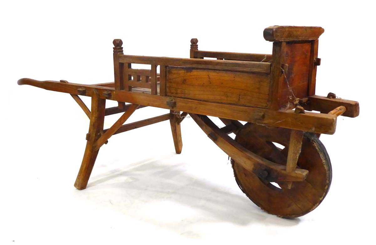 A Chinese elm wheelbarrow, l. 158 cm, w. 70 cm, h, 70.5 cm *from the collection of Phillip Allen (