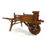 A Chinese elm wheelbarrow, l. 158 cm, w. 70 cm, h, 70.5 cm *from the collection of Phillip Allen (