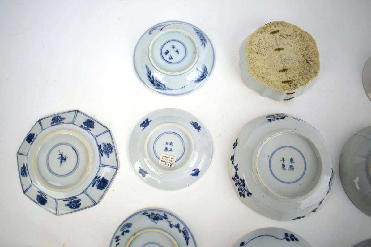 Eleven 18th century and later Chinese blue and white dishes and saucers including examples decorated - Image 6 of 8