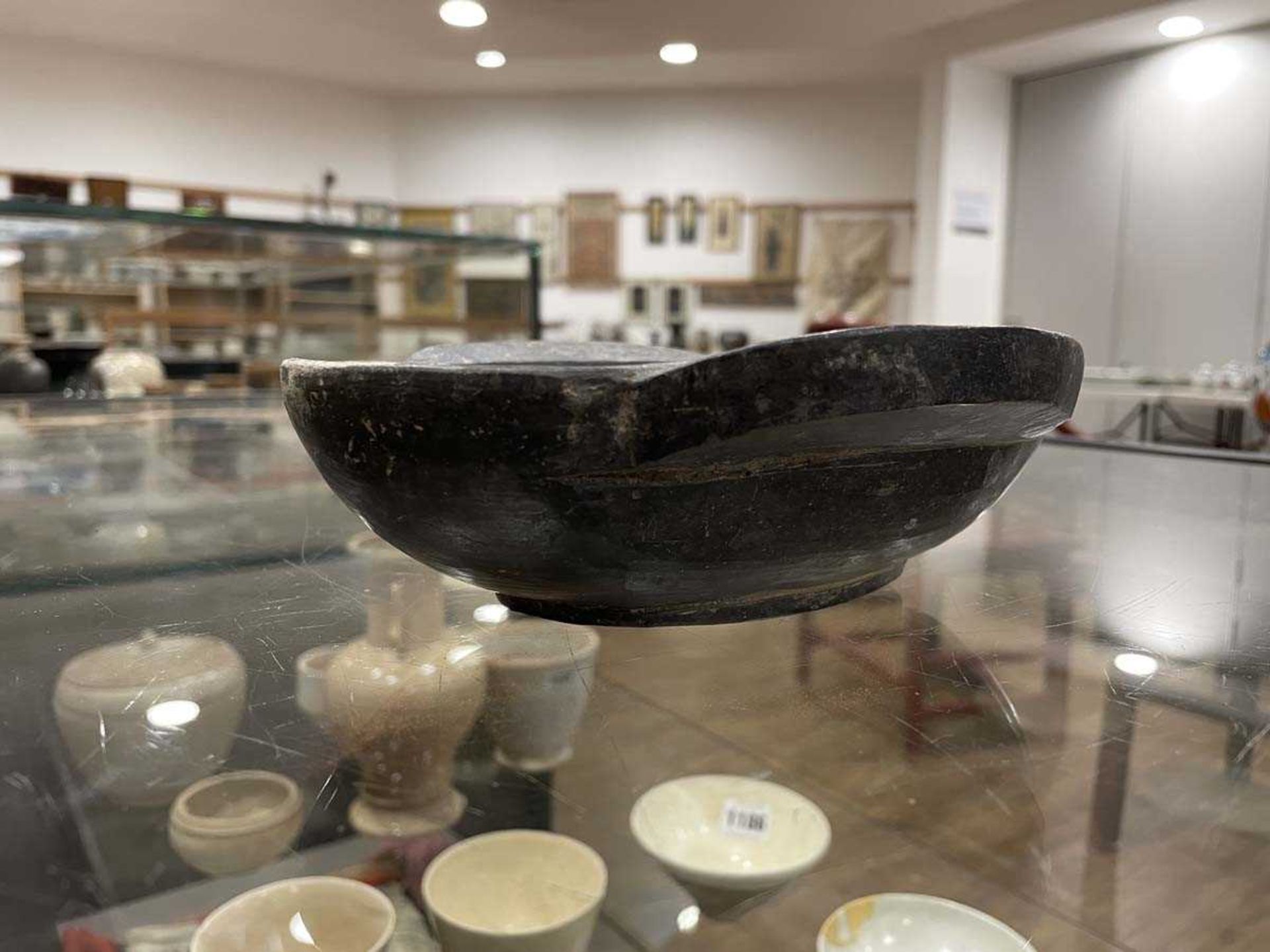 A Chinese archaic pottery ear cup decorated in a black glaze, l. 18 cm, boxed, together with two - Bild 19 aus 19