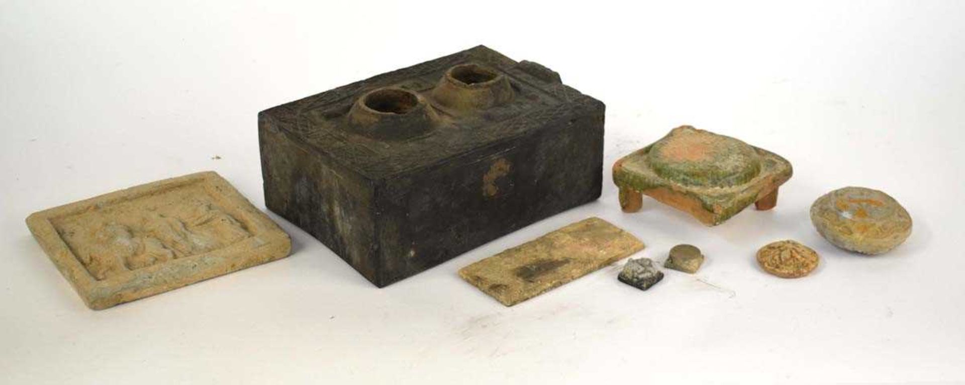 A Chinese pottery tomb figure modelled as a stove, possibly Tang, w. 27 cm, together with further